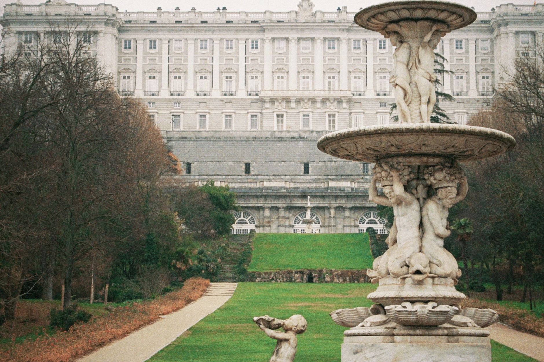 Iconic Royal Palace with a historic fountain in Campo del Moro, Madrid. — illustrating What Is Campo del Moro? Madrid's Royal Palace Garden