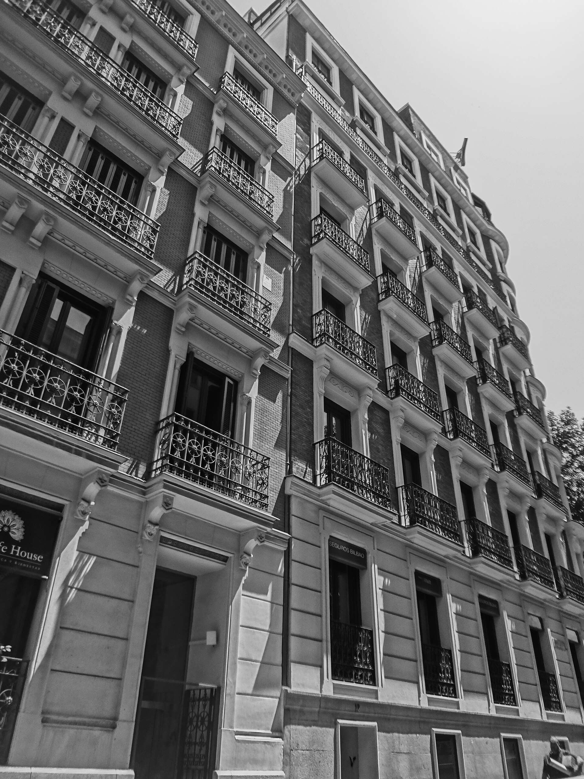 (Calle Salustiano Olózaga, Madrid) exterior black and white photograph of an antique building.jpg — illustrating Does the Siesta Actually Apply in Madrid? A Clear Answer