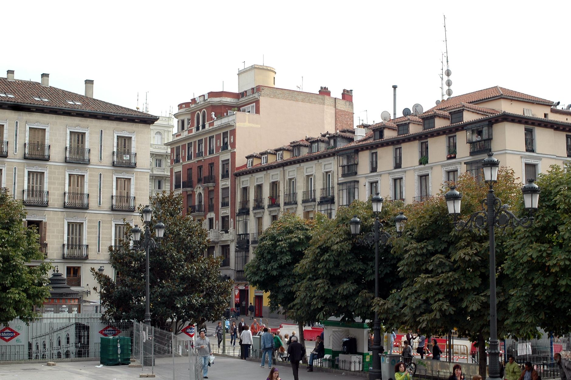 A bustling plaza in Madrid with historic architecture and vibrant street life.