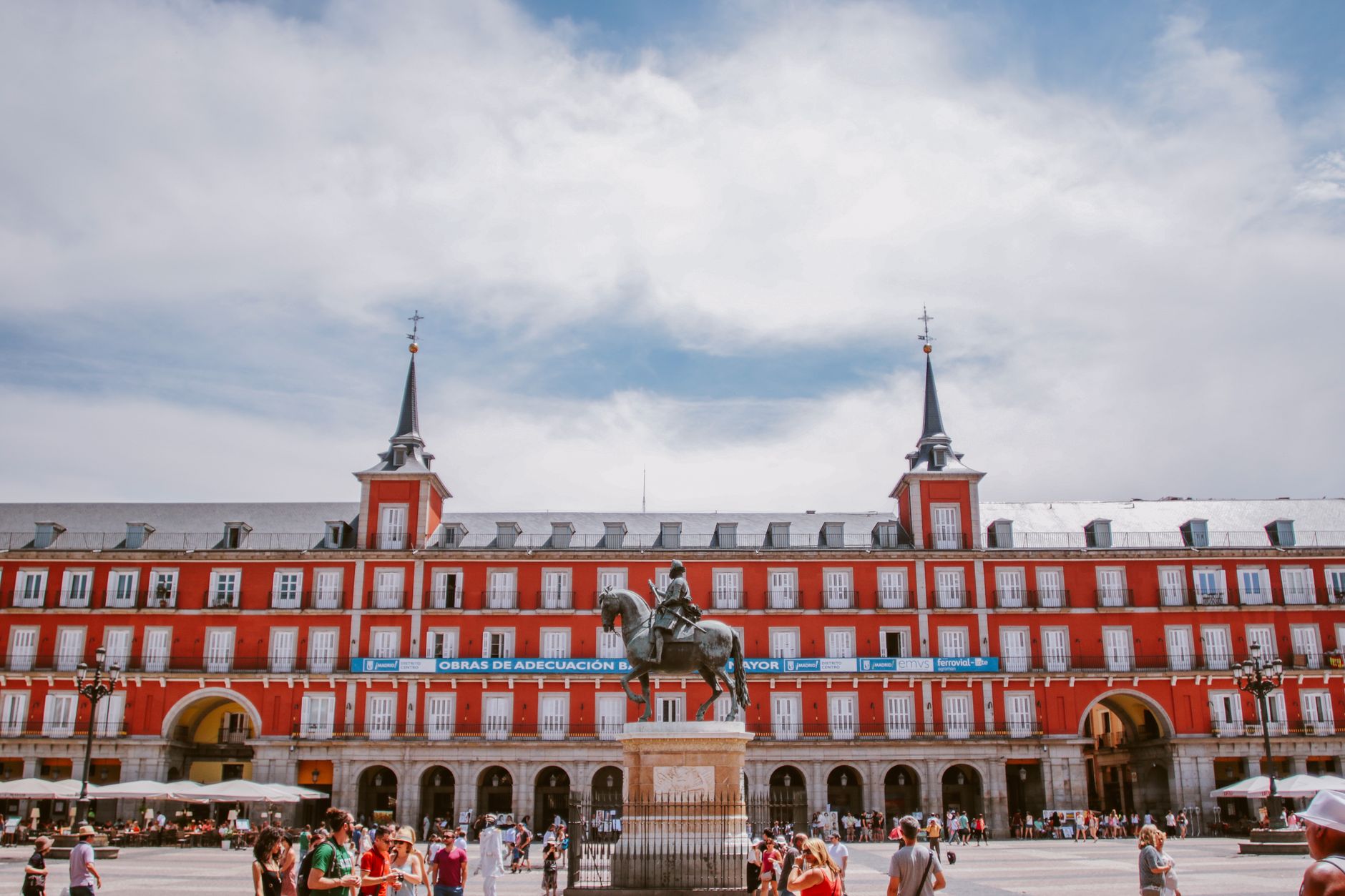 Vibrant view of Plaza Mayor in Madrid with historical architecture and bustling tourists. — illustrating What Is the Puerta de Alcalá? Madrid's Landmark Gate