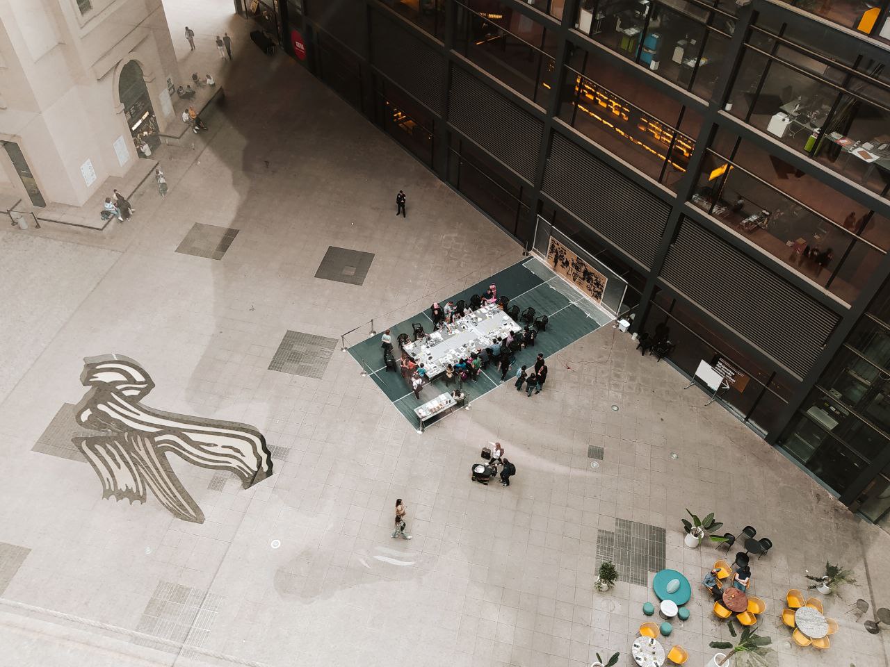 The Nouvel courtyard of the Reina Sofía museum, with its red canopy structure overhead