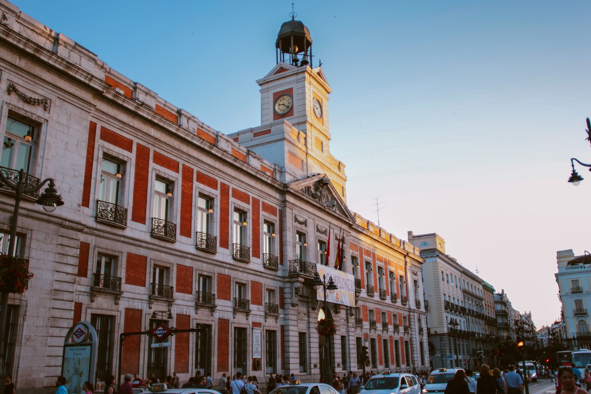 View of the iconic Puerta del Sol clock tower in Madrid, Spain, during dusk