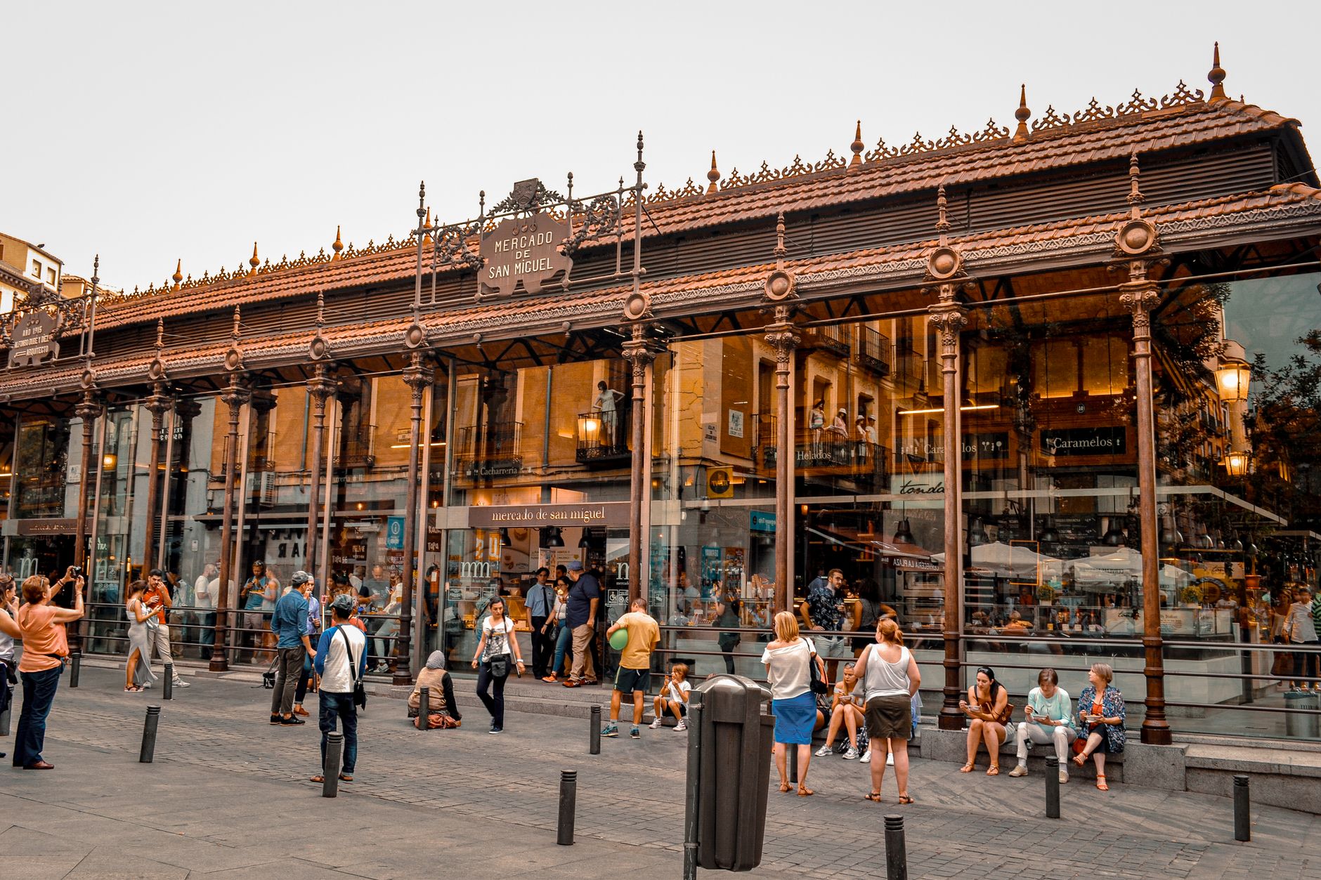 Bustling activity at Mercado de San Miguel in Madrid, a popular tourist spot with iconic architecture. — illustrating What Is a Taberna in Madrid, and How Does It Differ From a Bar