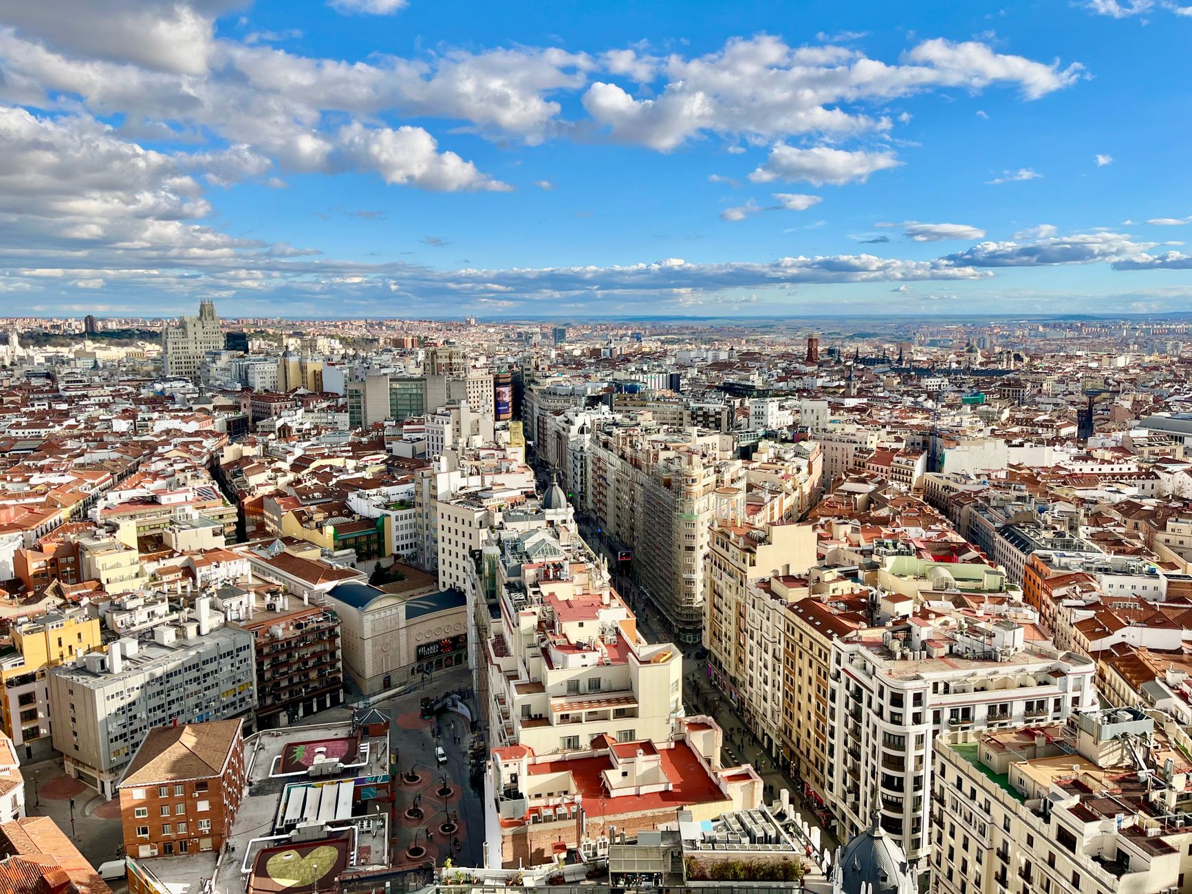 Stunning aerial view of Madrid's skyline with vibrant cityscape under a blue sky. — illustrating Timed Entry at Madrid's Major Sites: What to Know