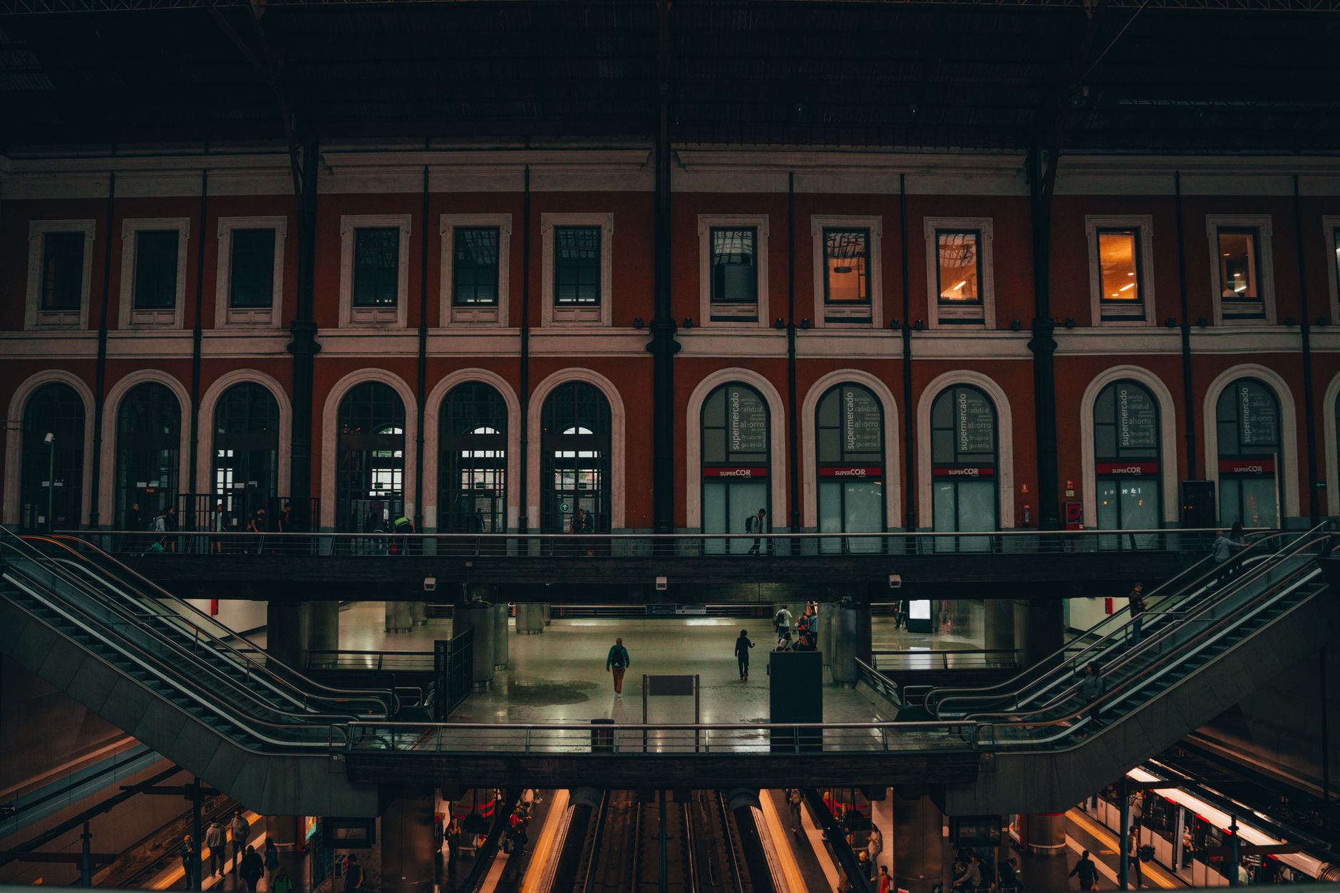 A view of Príncipe Pío train station in Madrid, showcasing its architectural design and evening ambiance.