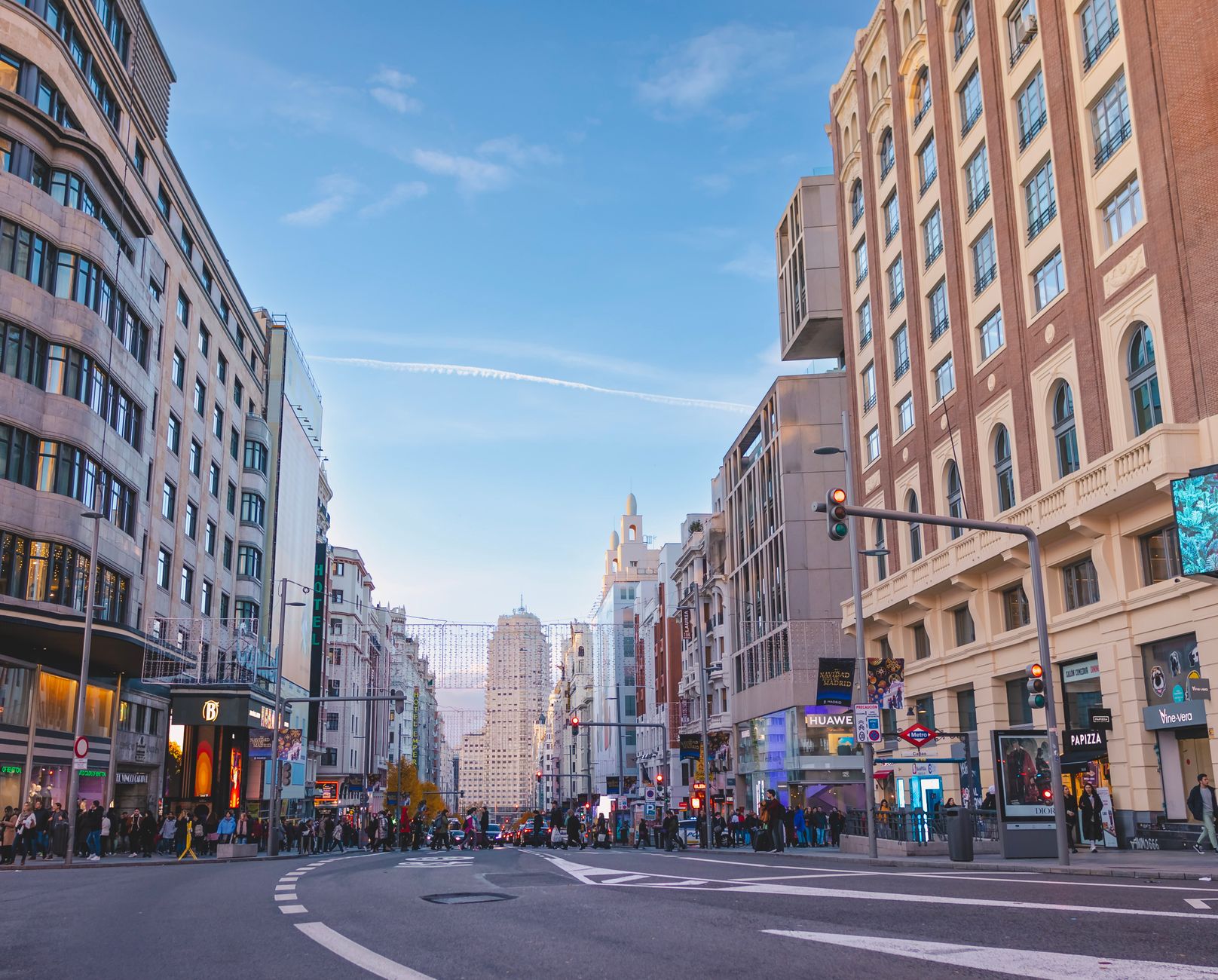 Bustling street scene on the iconic Gran Vía, Madrid's famous entertainment hub.