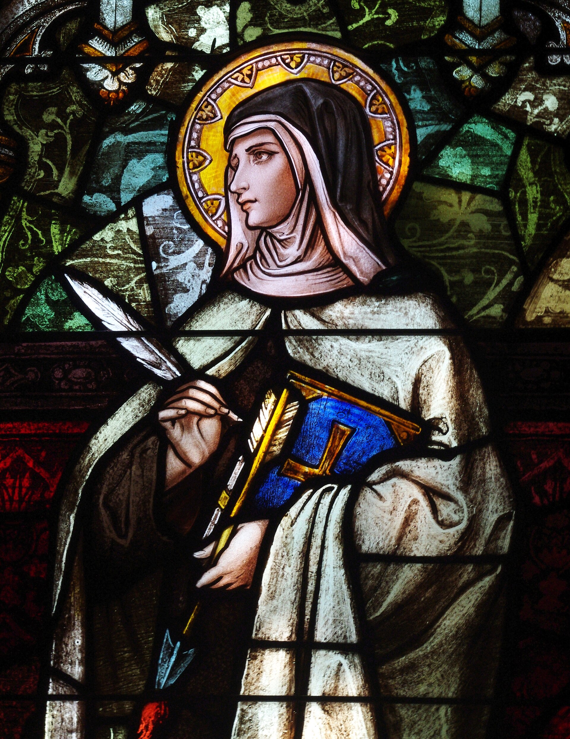 Stained glass window detail depicting Saint Teresa of Ávila